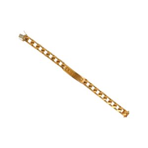 Bracelet d'identité - en or jaune 18K (750°/°°) à maille gourmette portant l'inscription "LUCIEN", fermoir à lame cliquet avec deux huit de sûreté.